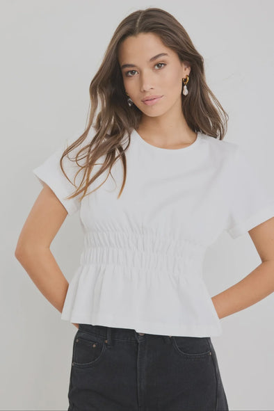 Classic crew neckline for timeless style

Short sleeves with rolled cuffs

Shirred waist detail for a flattering, tailored fit

Flared peplum-style hem for feminine movement

Made from soft, breathable 100% cotton