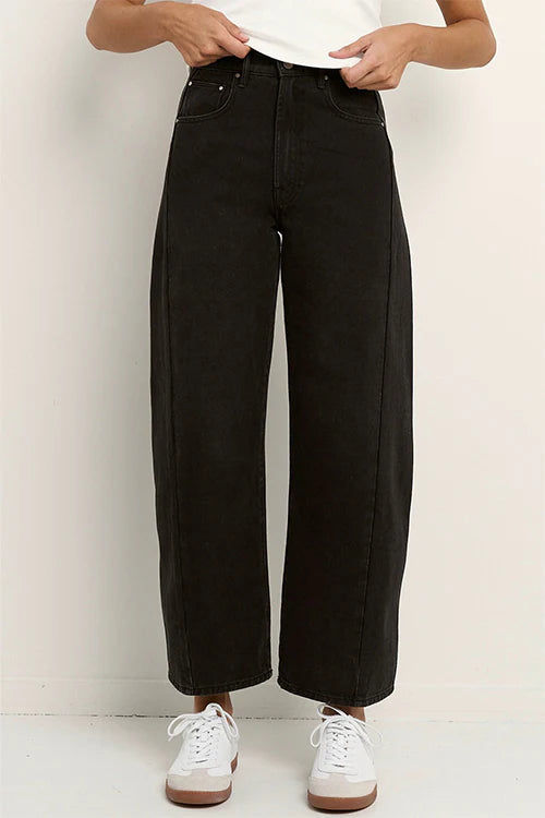 100% Cotton denim

Mid rise fit with a classic zip fly and button fastening

Barrel leg cut with gentle tapering at the hem

Slightly cropped length for a modern look

Washed black finish that softens beautifully over time

Designed true to size—size up if between sizes