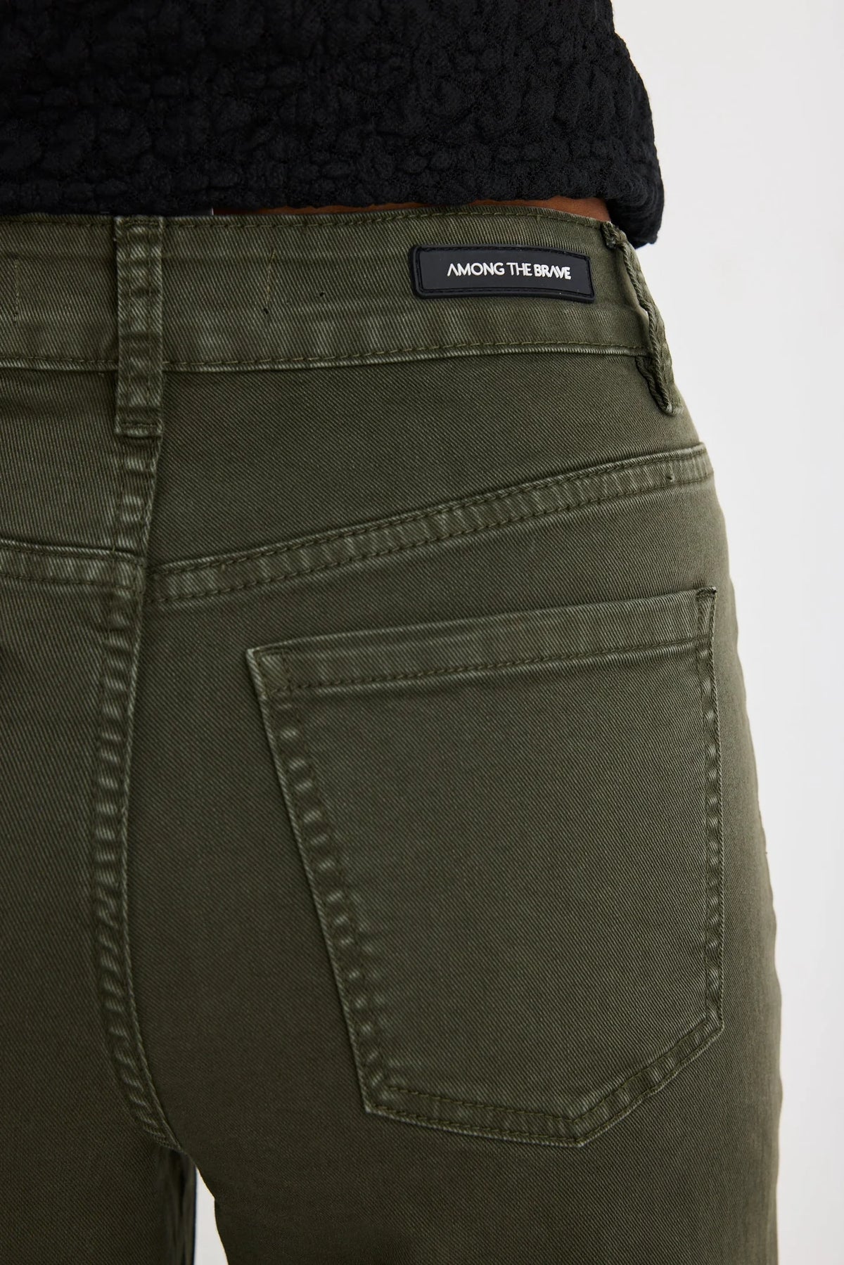 Flattering high-rise fit that cinches the waist

Wide leg silhouette for an effortlessly cool look

Soft stretch denim for all-day comfort

Functional front pockets

Easy-to-style dark khaki colour

Zip fly with fixed waistband

Fabric: 98% Cotton, 2% Elastane