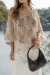 Oversized fit with romantic puff sleeves

Lightweight fabric with a soft, flowy drape

Unique floral-inspired animal print for a modern twist

Easy pull-on style for comfort and ease

Made from 100% polyester for a silky-soft feel 