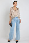 Oversized fit with romantic puff sleeves

Lightweight fabric with a soft, flowy drape

Unique floral-inspired animal print for a modern twist

Easy pull-on style for comfort and ease

Made from 100% polyester for a silky-soft feel