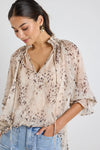 Oversized fit with romantic puff sleeves

Lightweight fabric with a soft, flowy drape

Unique floral-inspired animal print for a modern twist

Easy pull-on style for comfort and ease

Made from 100% polyester for a silky-soft feel