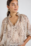 Oversized fit with romantic puff sleeves

Lightweight fabric with a soft, flowy drape

Unique floral-inspired animal print for a modern twist

Easy pull-on style for comfort and ease

Made from 100% polyester for a silky-soft feel