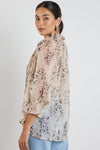 Oversized fit with romantic puff sleeves

Lightweight fabric with a soft, flowy drape

Unique floral-inspired animal print for a modern twist

Easy pull-on style for comfort and ease

Made from 100% polyester for a silky-soft feel