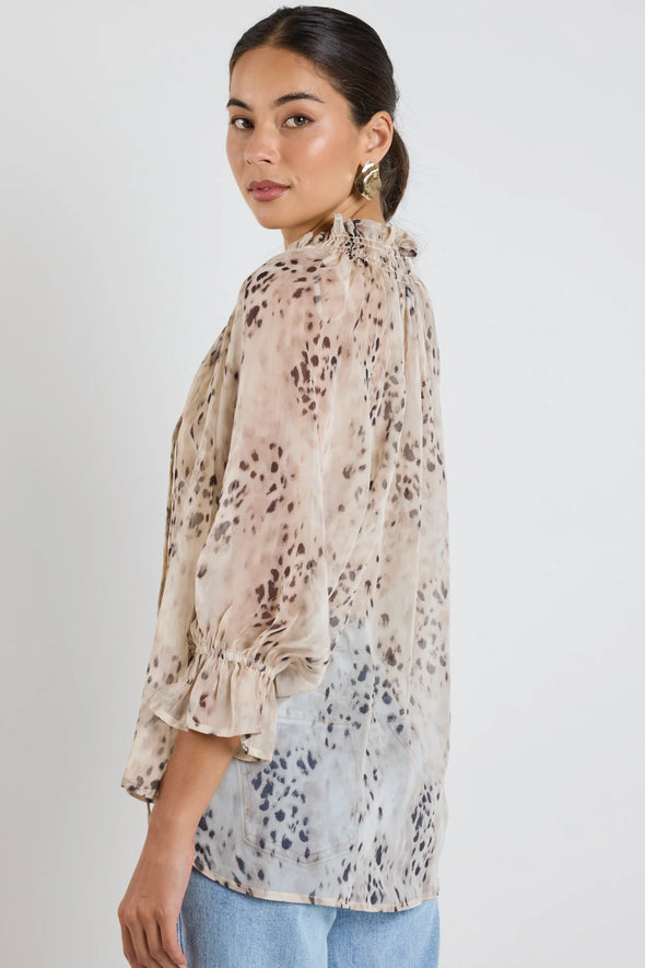 Oversized fit with romantic puff sleeves

Lightweight fabric with a soft, flowy drape

Unique floral-inspired animal print for a modern twist

Easy pull-on style for comfort and ease

Made from 100% polyester for a silky-soft feel