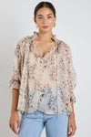 Oversized fit with romantic puff sleeves

Lightweight fabric with a soft, flowy drape

Unique floral-inspired animal print for a modern twist

Easy pull-on style for comfort and ease

Made from 100% polyester for a silky-soft feel
