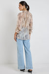 Oversized fit with romantic puff sleeves

Lightweight fabric with a soft, flowy drape

Unique floral-inspired animal print for a modern twist

Easy pull-on style for comfort and ease

Made from 100% polyester for a silky-soft feel