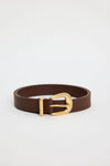 Elevate your everyday style with the sand leather belt from Among The Brave. Crafted from 3A grade leather, this versatile accessory features a sleek design complemented by a gold-tone buckle for a touch of sophistication. Perfect for cinching your favourite jeans or adding definition to dresses, this belt effortlessly enhances any outfit. Pair it with gold earrings to tie your look together!
