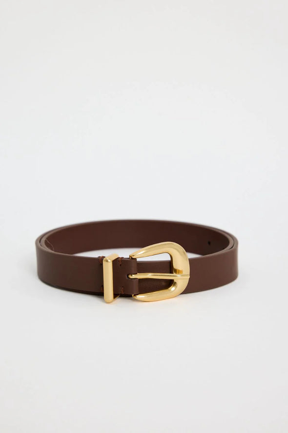 Elevate your everyday style with the sand leather belt from Among The Brave. Crafted from 3A grade leather, this versatile accessory features a sleek design complemented by a gold-tone buckle for a touch of sophistication. Perfect for cinching your favourite jeans or adding definition to dresses, this belt effortlessly enhances any outfit. Pair it with gold earrings to tie your look together!