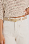 Elevate your everyday style with the sand leather belt from Among The Brave. Crafted from 3A grade leather, this versatile accessory features a sleek design complemented by a gold-tone buckle for a touch of sophistication. Perfect for cinching your favourite jeans or adding definition to dresses, this belt effortlessly enhances any outfit. Pair it with gold earrings to tie your look together!