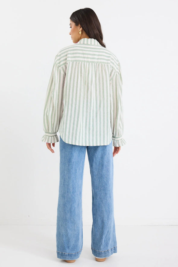 Experience easy elegance with this striped oversized shirt. Crafted from a soft, breathable cotton-linen blend, it feels as good as it looks. The roomy fit and playful balloon sleeves add a fun, carefree vibe that’s perfect for pairing with tailored trousers or your favorite denim. Refresh your high-low dressing game with this effortlessly cool staple.