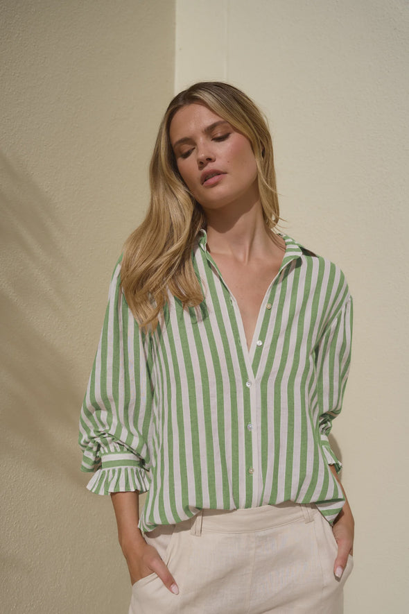 Experience easy elegance with this striped oversized shirt. Crafted from a soft, breathable cotton-linen blend, it feels as good as it looks. The roomy fit and playful balloon sleeves add a fun, carefree vibe that’s perfect for pairing with tailored trousers or your favorite denim. Refresh your high-low dressing game with this effortlessly cool staple.