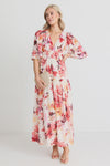 The Fluent vintage blush maxi dress gives off elegance and femininity with its v neck and flutter sleeves. The long flowing tiered maxi skirt adds a touch of romance to this fully lined floral dress. Perfect for any occasion, this dress will make you feel confident and beautiful. Add a pair of heels for a fun night out, or some sandals to relax in the sun.&nbsp;