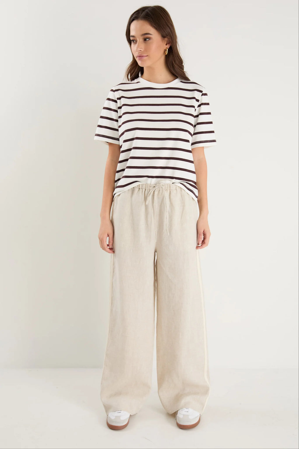 Key Features

Brown and white stripe design

Oversized boxy fit for a modern silhouette

Short sleeve

Fabric Composition - 100% Cotton
