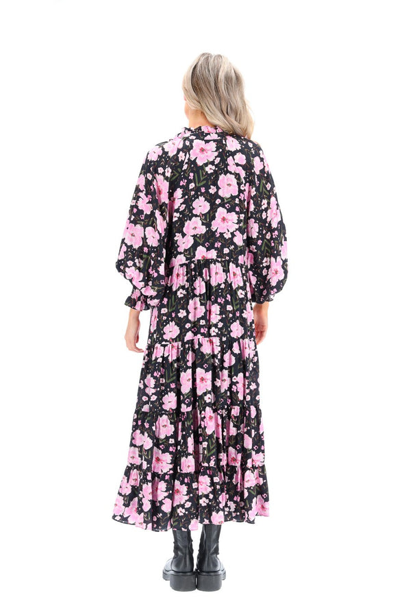 Make a statement with this stunning black-based floral print maxi dress. Featuring a vibrant floral pattern on a sleek black background, this floor-sweeping dress is perfect for formal events, summer gatherings, or everyday wear. The flowy design and comfortable fabric ensure a flattering fit for all body types.