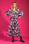 Make a statement with this stunning black-based floral print maxi dress. Featuring a vibrant floral pattern on a sleek black background, this floor-sweeping dress is perfect for formal events, summer gatherings, or everyday wear. The flowy design and comfortable fabric ensure a flattering fit for all body types.