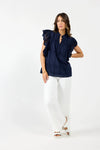 Elevate your summer wardrobe with Drama the Label's "Cards Top". This elegant top features delicate Embroidery Anglaise and a stylish Chinese Collar, along with a half-placket Button front and Sleeveless design. The cascading Frill adds a touch of grace, and the top is fully lined for comfort and quality. Pair it with Drama Shorts or Pants for a chic and sophisticated look!