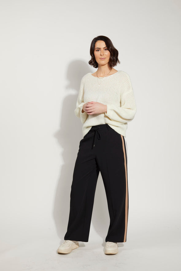 the Fee Jumper from Drama the Label's exquisite knitwear collection. This slightly oversized crew neck jumper boasts bellow sleeves