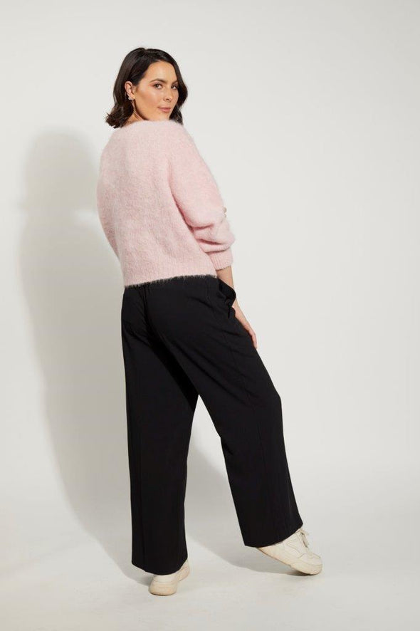  Lottie Jumper from Drama the Label's knitwear collection,&nbsp; available in the captivating shade of pink Coconut Ice. This super fluffy garment boasts a comfortable crew neck, long sleeves, 