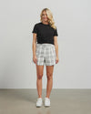 Fresh and summery in white and black cotton blend plaid, these cute shorts with front pleat detail and self belt are a must have. &nbsp;Style with a tank top or t-shirt for the beach or with the Kennedy Blazer in the matching fabric for an elevated summer 'suit' option.&nbsp;

COLOUR
White Plaid

FABRIC INFO
80% Cotton 20% Poly