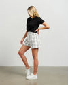 Fresh and summery in white and black cotton blend plaid, these cute shorts with front pleat detail and self belt are a must have. &nbsp;Style with a tank top or t-shirt for the beach or with the Kennedy Blazer in the matching fabric for an elevated summer 'suit' option.&nbsp;

COLOUR
White Plaid

FABRIC INFO
80% Cotton 20% Poly