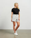 Fresh and summery in white and black cotton blend plaid, these cute shorts with front pleat detail and self belt are a must have. &nbsp;Style with a tank top or t-shirt for the beach or with the Kennedy Blazer in the matching fabric for an elevated summer 'suit' option.&nbsp;

COLOUR
White Plaid

FABRIC INFO
80% Cotton 20% Poly