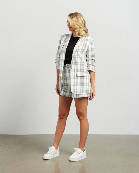 Blazers are having a big moment in fashion, and this style is on-trend with a slight masculine cut and longer length. This chic summer blazer is crafted in cotton blend plaid fabric and is fully lined, and the shorter length sleeves with tucked pleats at the elbow give it a relaxed vibe.

COLOUR
White Plaid

FABRIC INFO
80% Cotton 20% Poly