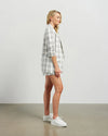 Blazers are having a big moment in fashion, and this style is on-trend with a slight masculine cut and longer length. This chic summer blazer is crafted in cotton blend plaid fabric and is fully lined, and the shorter length sleeves with tucked pleats at the elbow give it a relaxed vibe.

COLOUR
White Plaid

FABRIC INFO
80% Cotton 20% Poly