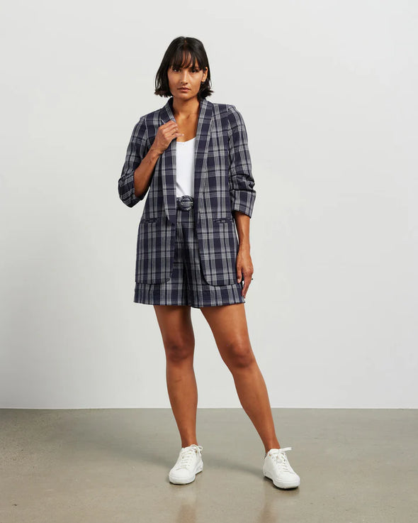 Blazers are having a big moment in fashion, and this style is on-trend with a slight masculine cut and longer length. This chic summer blazer is crafted in cotton blend plaid fabric and is fully lined, and the shorter length sleeves with tucked pleats at the elbow give it a relaxed vibe.

COLOUR
Ink Plaid

FABRIC INFO
80% Cotton 20% Poly