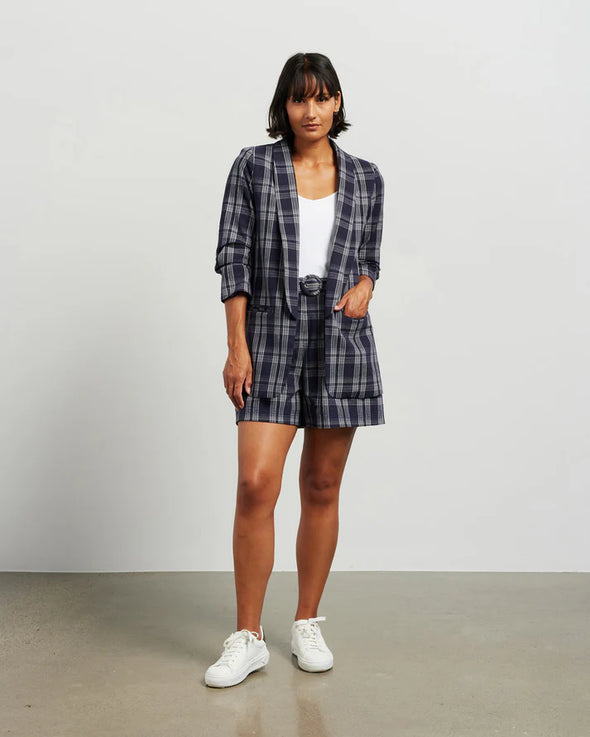 Blazers are having a big moment in fashion, and this style is on-trend with a slight masculine cut and longer length. This chic summer blazer is crafted in cotton blend plaid fabric and is fully lined, and the shorter length sleeves with tucked pleats at the elbow give it a relaxed vibe.

COLOUR
Ink Plaid

FABRIC INFO
80% Cotton 20% Poly