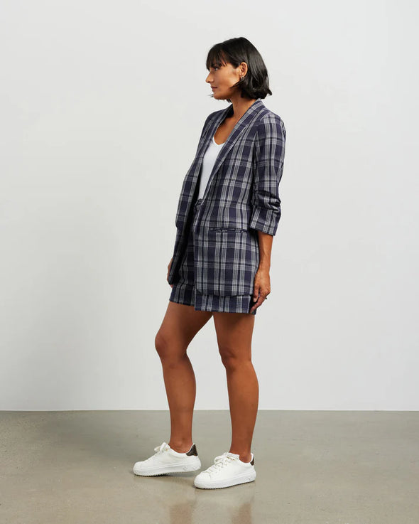 Blazers are having a big moment in fashion, and this style is on-trend with a slight masculine cut and longer length. This chic summer blazer is crafted in cotton blend plaid fabric and is fully lined, and the shorter length sleeves with tucked pleats at the elbow give it a relaxed vibe.

COLOUR
Ink Plaid

FABRIC INFO
80% Cotton 20% Poly