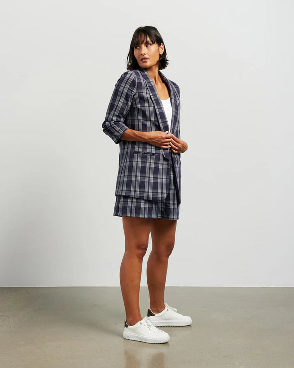 Blazers are having a big moment in fashion, and this style is on-trend with a slight masculine cut and longer length. This chic summer blazer is crafted in cotton blend plaid fabric and is fully lined, and the shorter length sleeves with tucked pleats at the elbow give it a relaxed vibe.

COLOUR
Ink Plaid

FABRIC INFO
80% Cotton 20% Poly