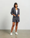 Blazers are having a big moment in fashion, and this style is on-trend with a slight masculine cut and longer length. This chic summer blazer is crafted in cotton blend plaid fabric and is fully lined, and the shorter length sleeves with tucked pleats at the elbow give it a relaxed vibe.

COLOUR
Ink Plaid

FABRIC INFO
80% Cotton 20% Poly