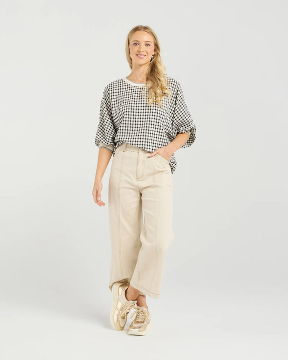 Best-selling easy fit top updated in a check print

Contrast striped rib neck and cuffs for a luxe finish

Playful monochrome design for versatile styling

Crafted from a comfortable 94% Polyester, 6% Spandex blend

A wardrobe must-have for easy, everyday chic