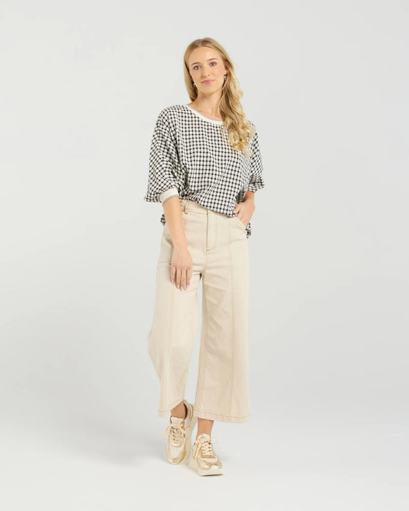 Best-selling easy fit top updated in a check print

Contrast striped rib neck and cuffs for a luxe finish

Playful monochrome design for versatile styling

Crafted from a comfortable 94% Polyester, 6% Spandex blend

A wardrobe must-have for easy, everyday chic