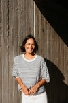 Best-selling easy fit top updated in a check print

Contrast striped rib neck and cuffs for a luxe finish

Playful monochrome design for versatile styling

Crafted from a comfortable 94% Polyester, 6% Spandex blend

A wardrobe must-have for easy, everyday chic