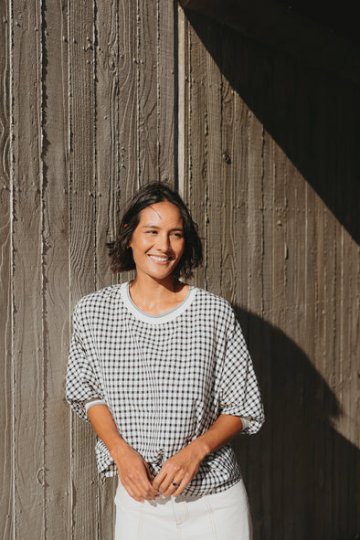 Best-selling easy fit top updated in a check print

Contrast striped rib neck and cuffs for a luxe finish

Playful monochrome design for versatile styling

Crafted from a comfortable 94% Polyester, 6% Spandex blend

A wardrobe must-have for easy, everyday chic