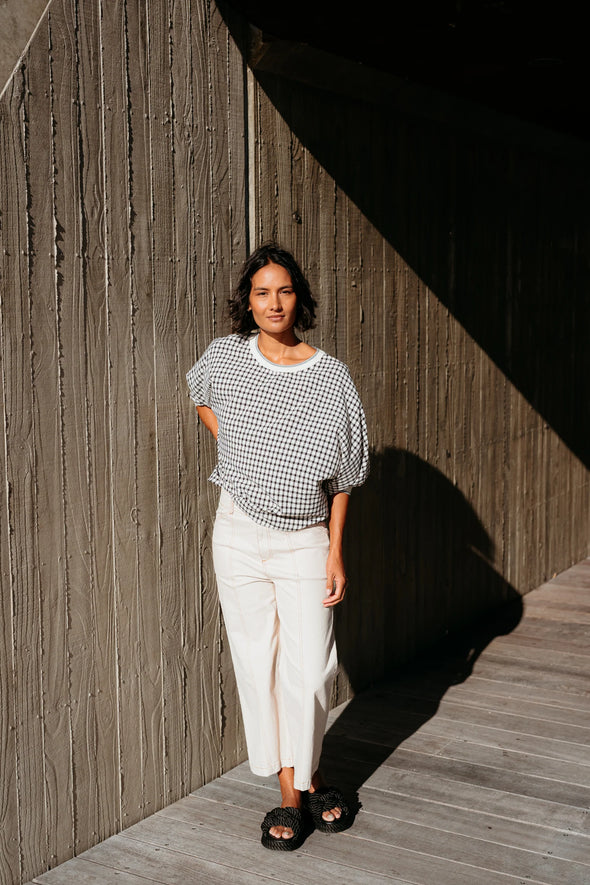Best-selling easy fit top updated in a check print

Contrast striped rib neck and cuffs for a luxe finish

Playful monochrome design for versatile styling

Crafted from a comfortable 94% Polyester, 6% Spandex blend

A wardrobe must-have for easy, everyday chic
