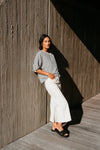Best-selling easy fit top updated in a check print

Contrast striped rib neck and cuffs for a luxe finish

Playful monochrome design for versatile styling

Crafted from a comfortable 94% Polyester, 6% Spandex blend

A wardrobe must-have for easy, everyday chic