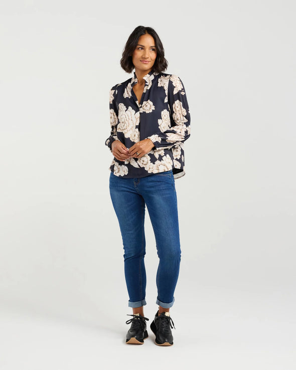 The Evelyn Blouse in Honeydew is a perfect combination of beautiful design and pretty print. It boasts a split V-neckline with a ruffle neckline, sheer full-length sleeves with gathered detail, and elastic hems. The fully lined body adds the perfect finishing touch. Dress it up or down for any occasion - The top that will not only meet the brief for 'jeans and a nice top' it will have you go from the office to the wine bar without skipping a beat!