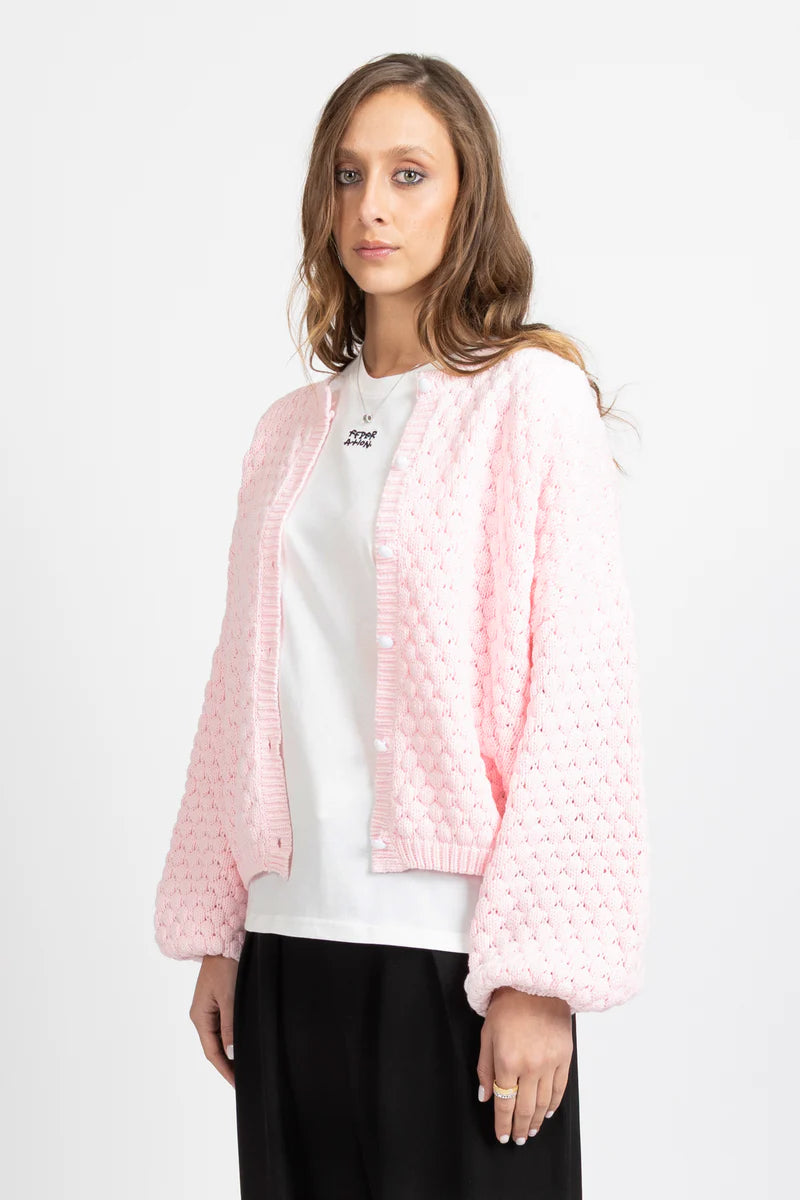Textured honeycomb knit for added dimension
Relaxed oversized fit for effortless styling
Statement balloon sleeves
Elegant pearl button front closure
Wear open as a layer or closed as a knit top
Slightly cropped length for modern proportions
Designed in New Zealand by Federation
Oversized fit
Take your usual size for a relaxed look, or size down for a neater fit
60% Cotton 40% Acrylic