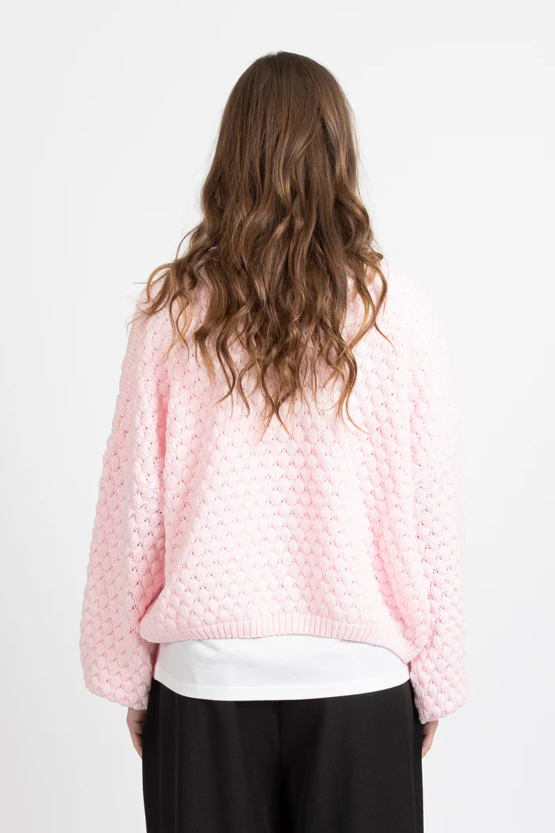 Textured honeycomb knit for added dimension
Relaxed oversized fit for effortless styling
Statement balloon sleeves
Elegant pearl button front closure
Wear open as a layer or closed as a knit top
Slightly cropped length for modern proportions
Designed in New Zealand by Federation
Oversized fit
Take your usual size for a relaxed look, or size down for a neater fit
60% Cotton 40% Acrylic