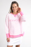 Meet your new go-to layer....The Foxwood Simplified Crew in Neon Pink Stripe. This vibrant piece is designed for effortless style and comfort, making it a must-have addition to your casual wardrobe. The crew features a relaxed round neck, trendy hi-lo hemline with side splits, and raw edge detailing that adds a touch of edge to your everyday looks. The embroidered Foxwood logo across the chest elevates the overall design, giving it that signature appeal.