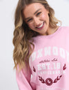 Snuggle up in style with Foxwood's Women's Pink Sweatshirt! The eye-catching "Foxwood" logo adds just the right amount of sass to this ultra-cozy essential. Crafted from fabric so soft you'll want to live in it, this pretty-in-pink number transitions effortlessly from Netflix marathons to coffee dates. Warning: Friends may experience extreme outfit envy when you rock this with your go-to leggings or jeans!