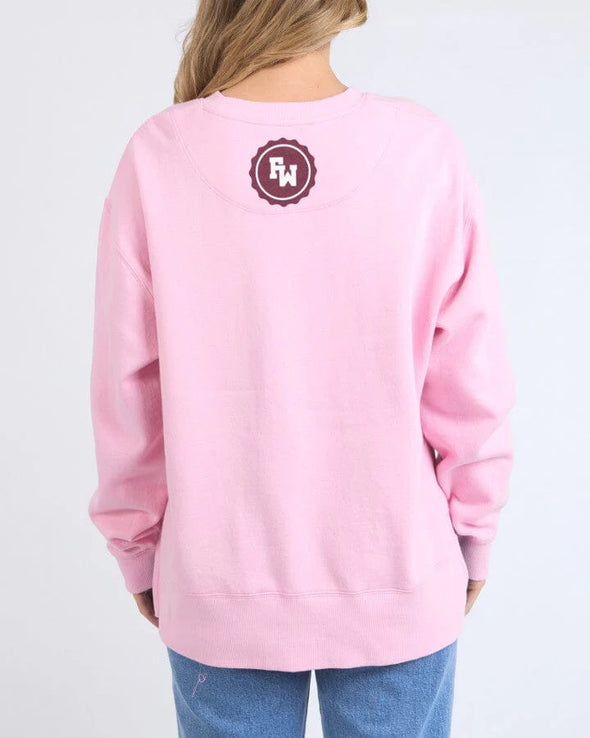 Snuggle up in style with Foxwood's Women's Pink Sweatshirt! The eye-catching "Foxwood" logo adds just the right amount of sass to this ultra-cozy essential. Crafted from fabric so soft you'll want to live in it, this pretty-in-pink number transitions effortlessly from Netflix marathons to coffee dates. Warning: Friends may experience extreme outfit envy when you rock this with your go-to leggings or jeans!