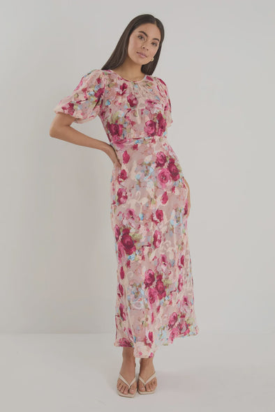 Bias-cut silhouette for beautiful drape and body-skimming shape

Puff sleeves for playful volume and romantic detail

Fully lined for comfort, coverage, and a premium finish

Delicate fabric—best cared for with gentle handling

Painterly rose-floral print for standout style

Fabric: 100% Polyester