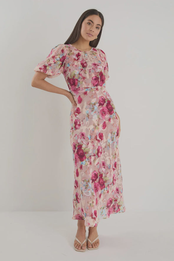 Bias-cut silhouette for beautiful drape and body-skimming shape

Puff sleeves for playful volume and romantic detail

Fully lined for comfort, coverage, and a premium finish

Delicate fabric—best cared for with gentle handling

Painterly rose-floral print for standout style

Fabric: 100% Polyester