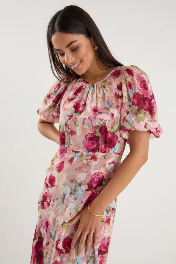 Bias-cut silhouette for beautiful drape and body-skimming shape

Puff sleeves for playful volume and romantic detail

Fully lined for comfort, coverage, and a premium finish

Delicate fabric—best cared for with gentle handling

Painterly rose-floral print for standout style

Fabric: 100% Polyester