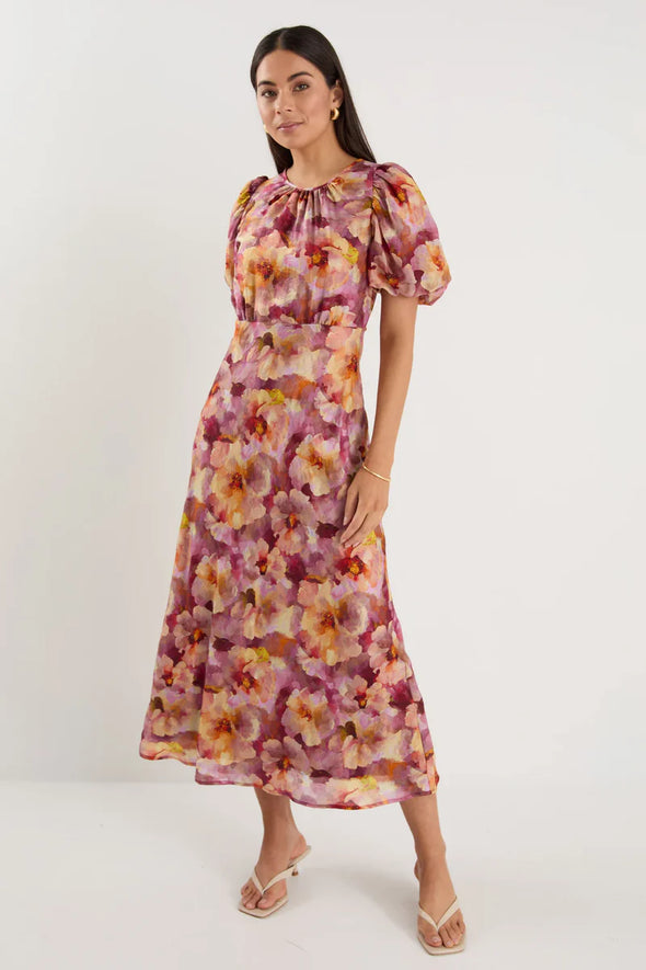 Bias-cut silhouette for a flattering drape and elegant movement

Puff sleeves for romantic shape and soft volume

Fully lined for added comfort and confidence

Statement painterly floral print

Delicate fabric—handle with care

Fabric Composition: 72% Lyocell, 28% Nylon