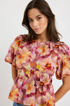Voluminous bubble short sleeves for a playful, elevated look

Elasticated waist detail for a comfortable, flattering fit

Classic crew neckline for easy styling

Bold pink multi-floral print with painterly detail

Lightweight and breathable for all-day comfort

Fabric: 72% Lyocell, 28% Nylon